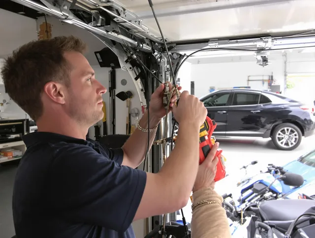 North Smithfield Garage Door Repair safety certified technician performing cable replacement in North Smithfield