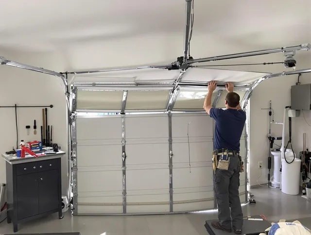 North Smithfield Garage Door Repair specialist performing precise section replacement on North Smithfield garage door